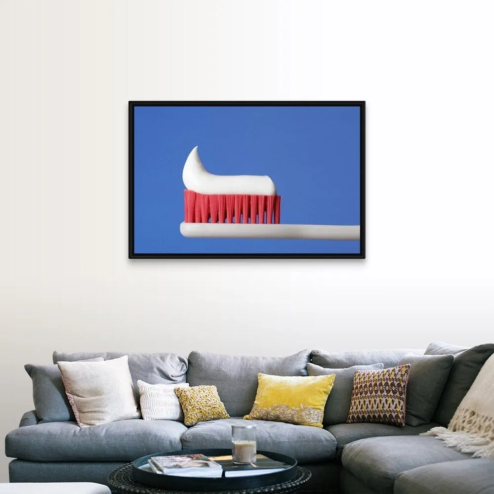 "Close-up of toothpaste on a toothbrush" Black Float Frame Canvas Art - Multi