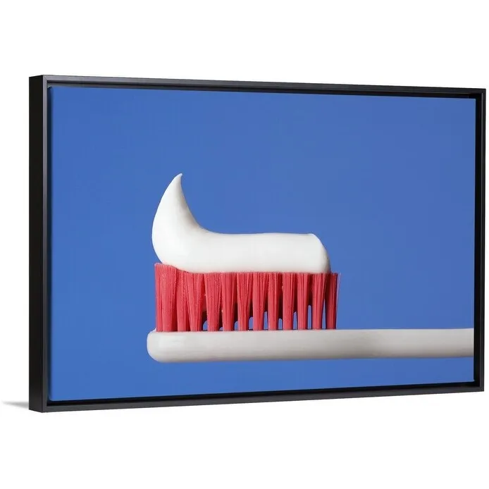 "Close-up of toothpaste on a toothbrush" Black Float Frame Canvas Art - Multi